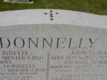 Monnaie sur le monument funraire des Donnelly, cimetire catholique St. Patrick, Biddulph, 2005
