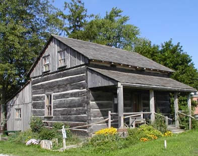 [ Front View of the Cabin at the Lucan Area Heritage and Donnelly Museum, This cabin was moved to Lucan from Port Elgin, Ontario.  Though not identical to the Donnelly cabin, it is very similar.   Copyright Great Unsolved Canadian Mysteries Project, Jennifer Pettit,   ]