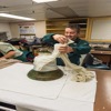 Unwrapping the HMS Erebus bell in a lab aboard the CCG ship Sir Wilfrid Laurier