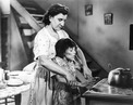Marie-Louise Burning Aurore's hands on the Stove