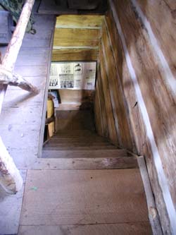 [ View From Upstairs, Lucan Area Heritage and Donnelly Museum, The museum's log home is a recreation of the original Donnelly cabin that burned the night of the murders in 1880. Copyright Great Unsolved Canadian Mysteries Project, Jennifer Pettit,   ]