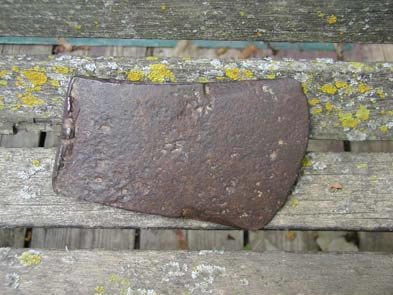 [ Axe Found at the Donnelly Homestead, Many objects have been unearthed at the site of the Donnelly homestead.  Some of the items may have belonged to the original Donnelly family.   Copyright Great Unsolved Canadian Mysteries Project, Jennifer Pettit,   ]