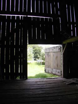 [ View From the Interior of the Barn Towards the House Built on the Donnelly Property in 1881 by William, Patrick and Robert Donnelly, Copyright Great Unsolved Canadian Mysteries Project, Jennifer Pettit,   ]
