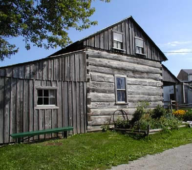 [ Side View of the Cabin at the Lucan and Area Heritage and Donnelly Museum, This cabin was moved to Lucan from Port Elgin, Ontario.  Though not identical to the Donnelly cabin, it is very similar.   Copyright Great Unsolved Canadian Mysteries Project, Jennifer Pettit,   ]