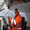 Canadian Coast Guard Coxswain Kurt Westle at the Helm of the "Kinglett"