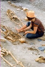A woman unearths skeletons