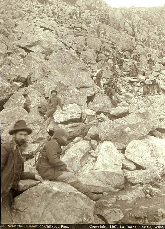 [ Klondikers with Indian packers near the summit of Chilkoot Pass ]