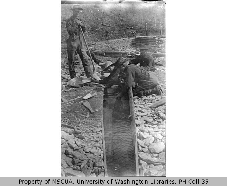 [ Mining operation showing four men with gold pan and sluice, Bonanza Creek ]