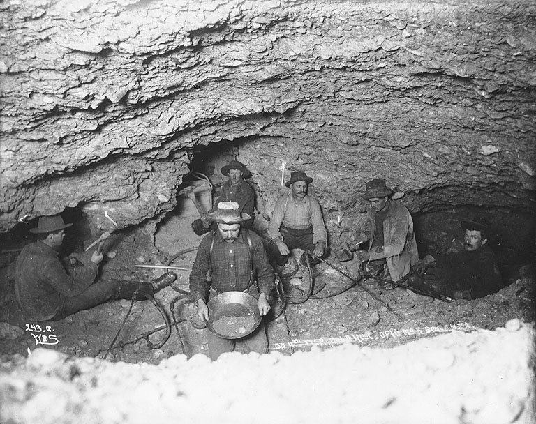 [ Miners thawing frozen ground with steam in an underground gold mine lit by candlelight, Gold Hill ]