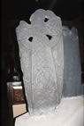 Stone cross in a church, the Kirk Michael on the Isle of Man, showing a mix of Norse and Celtic artistic styles.